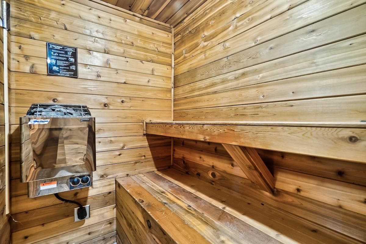 Relax and rejuvenate in the indoor sauna located on the lower level, offering a warm and inviting escape perfect for unwinding after a day of adventure