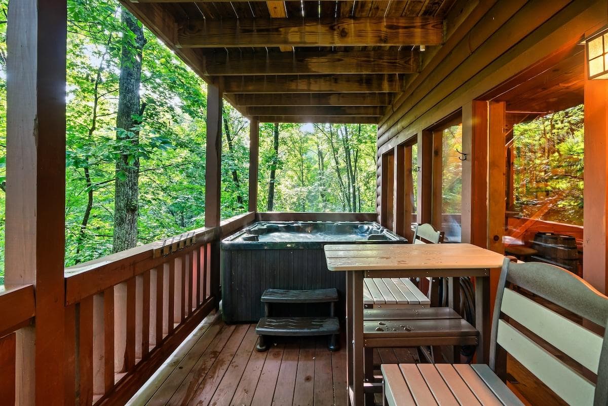 Unwind on the lower level deck, where a soothing hot tub, comfortable Polywood chairs and tables provide the perfect spot to relax and enjoy peaceful wooded views