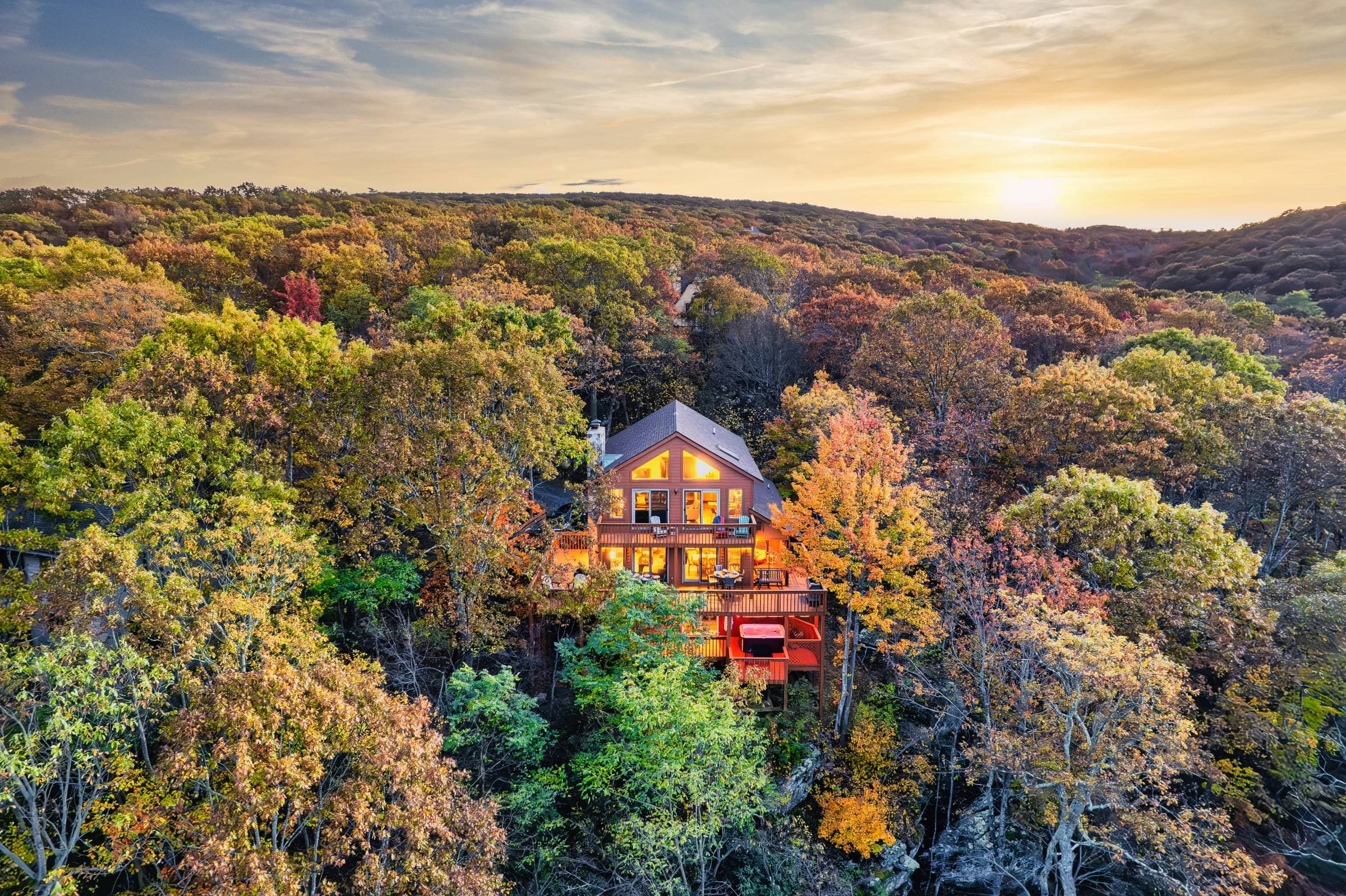Experience mountain magic at this secluded Rockstar Ridge cabin surrounded by golden fall trees. Watch sunsets from the deck, soak in the hot tub, and enjoy a peaceful escape with breathtaking panoramic views of the Blue Ridge landscape.